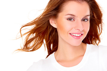 Image showing Portrait of cute young woman over white