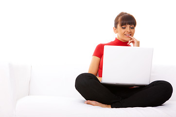 Image showing Girl with laptop on couch