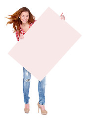 Image showing Young woman in casual clothing holding empty board