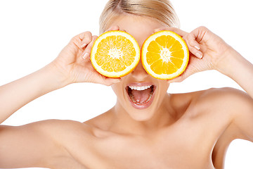 Image showing Blond woman making glasses with orange halfs