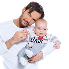 Image showing Proud young father posing with his baby