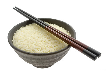 Image showing Bowl of rice with chopsticks

