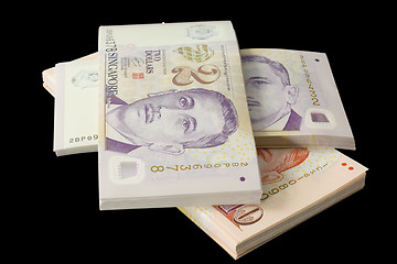 Image showing Stacks of Singapore currency

