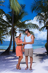 Image showing Couple nex to Palm tree