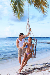 Image showing Couple next to Palm tree