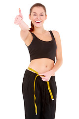 Image showing Fitness woman with measure tape