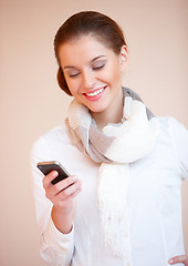 Image showing Brunette woman using mobile phone