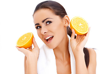 Image showing Woman with fresh orange halfs in her hands