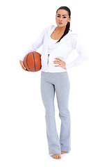 Image showing Woman standing and holding basketball