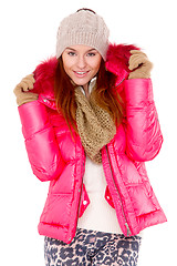 Image showing Young woman wearing winter jacket scarf and cap