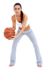 Image showing Woman standing and holding basketball