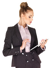 Image showing Young business woman working on tablet