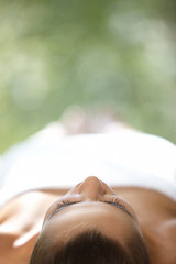 Image showing Beautiful woman is resting on spa bed