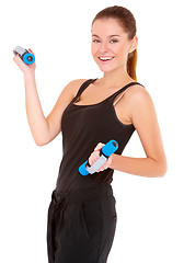 Image showing Portrait of fitness woman working out with free weights