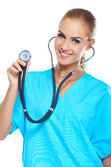 Image showing Pretty young doctor holding her stethoscope while isolated