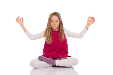 Image showing Young girl making yoga