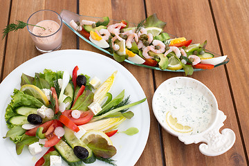 Image showing Greek salad and shrimp cocktail