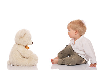 Image showing Little boy and teddy bear