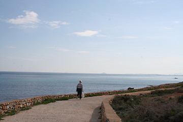 Image showing Man on walk beside the sea