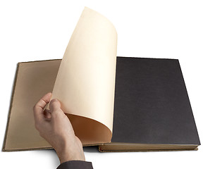 Image showing Hand turning page