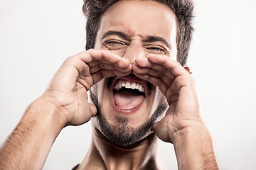 Image showing Young man shouting