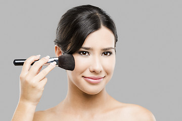 Image showing Applying makeup