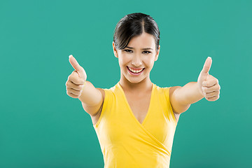 Image showing Happy woman with thumbs up