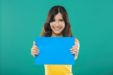 Image showing Holding a blue paper