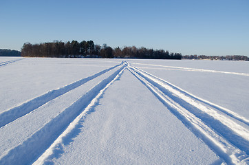 Image showing Snowmobile winter transport marks frozen lake snow 