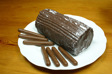 Image showing yulelog and chocolate finger biscuits