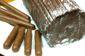 Image showing yulelog and chocolate finger biscuits