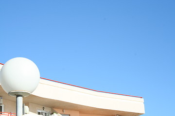 Image showing Roof and lamp against the blue sky