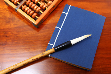 Image showing Chinese book , abacus and writing brush