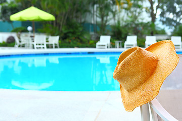 Image showing Wicker hat with swimming pool 