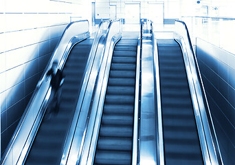 Image showing Person in motion on escalator