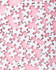 Image showing White puzzle on pink background