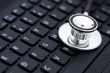 Image showing medical stethoscope on computer keyboard