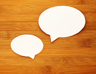 Image showing paper speech bubble on wood background