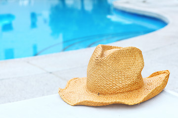 Image showing Wicker hat with swimming pool 