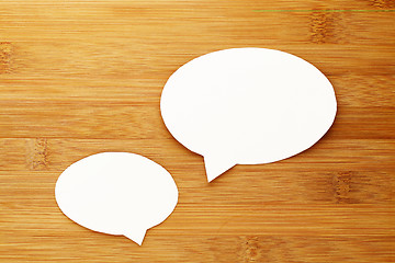 Image showing talk speech bubble on wood background