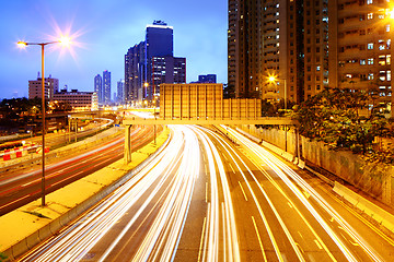 Image showing Cityscape at night with light trail 