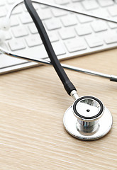 Image showing Stethoscope and keyboard 