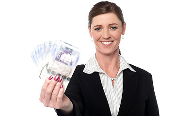 Image showing Corprorate woman holding currency notes