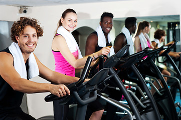 Image showing People at gym working out happily