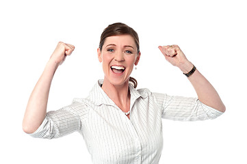 Image showing Excited corporate lady with clenched fists