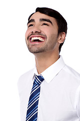 Image showing Happy corporate male looking upwards