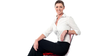 Image showing Relaxed smiling corporate lady