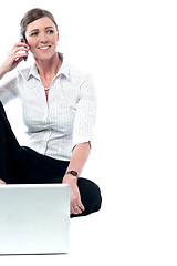 Image showing Relaxed female manager communicating