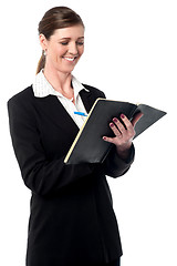 Image showing Corporate woman marking her schedule