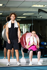 Image showing Strong fit man and woman posing casually